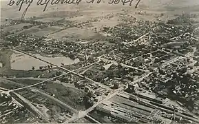 1919 aerial view of Carroll's pond (Noxon factory roof in foreground).