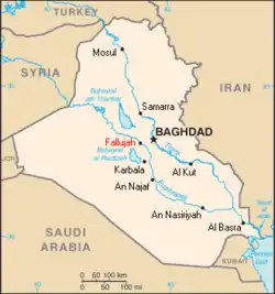 A tan political map of Iraq with major cities' names written in black and Fallujah noted in red