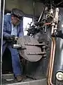 Driver firing a 2-6-2T built at Tubize works in Belgium in 1947