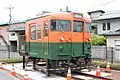 The cab end of car KuMoHa 169 27 preserved next to Shimoyoshida Station on the Fujikyuko Line in Yamanashi Prefecture