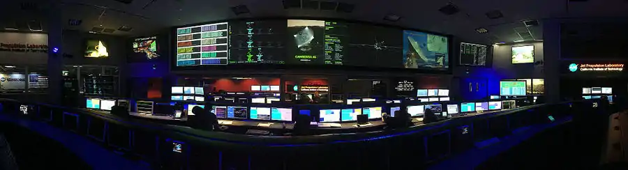 panaorama of the SFOF from the center of the room between the  Cassini and Curiosity mission control consoles