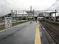 A view of the platforms and tracks showing how the station building spans the tracks.