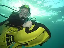 Recreational diver using a lightweight diver propulsion vehicle