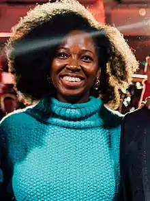 Woman in a blue jumper smiling