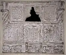 16th century mural monument believed to be James Coffin, surrounded by escutcheons of the Coffin arms