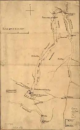 Fort Carillon, at the far northern end of the map, is separated from Lake George by a short river with falls. There is a road or path leading from the fort to the northern end of the lake with a sawmill at the first crossing.  The map is labeled with mountains on both sides of Lake George, which is long and narrow and extends about three fourths of the length of the map. At its southern end, the fort is shown, with the French camp to the northwest and the camp of Indians and Canadians over the road leading south toward Fort Edward, which is near the bottom of the map on the Hudson River just below some falls.