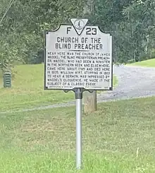 Grey and black historical highway marker