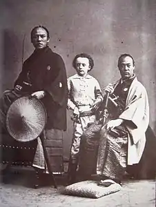 Nadar's son (center) with Yatsu Kanshiro (left) and an unnamed samurai (right), photographed by Nadar. They were members of the Second Japanese Embassy to Europe in 1863.