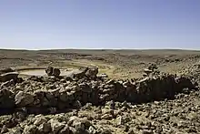 Photograph of remains of the city gate of Jawa, a Bronze Age city in the Black Desert, eastern Jordan.