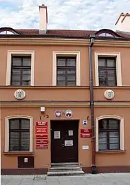 Main door, topped by eyelid dormers