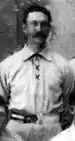 Jiggs Parrott standing as a member of the Chicago Colts in 1895.