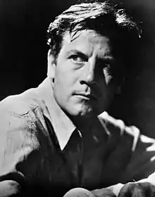 Joel McCrea, with his face partially in shadow