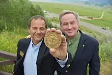 National Museum Wildlife Art Director Steve Seamons and National Geographic Photographer Joel Sartore pose with the Rungius Medal in June, 2017.