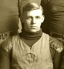 A man in an old football uniform