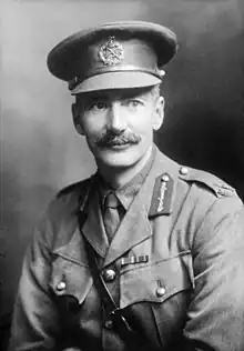 A black and white portrait of a male in uniform