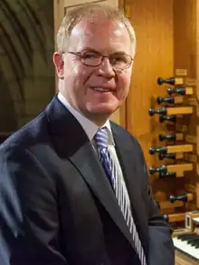 Portrait of John Scott with Organ at St Thomas Church in New York, NY