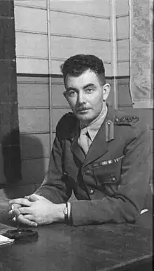 O'Brien in uniform sitting at a desk