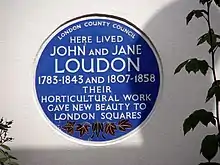 Circular plaque reading "London County Council - Here lived John and Jane Loudon - 1783-1845 and 1807-1858 - Their horticultural work gave new beauty to London squares"