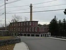 The Capron mill, built by John Capron Sr. and his sons Effingham, and John, circa 1820, at Uxbridge, Massachusetts. The mill manufactured the first satinets, used the first power looms for woolens in America, and made US military uniforms for over 140 years.