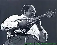 Johnny Young playing his mandolin