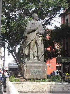 A bronze statue in a street