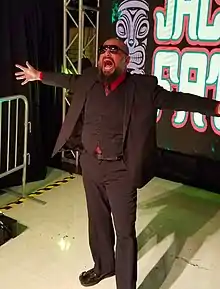 Josef Samael accompanying Jacob Fatu to the ring during his entrance