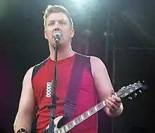 Josh Homme playing guitar