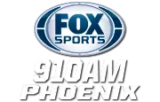 The Fox Sports logo, a silver oval with blue trim and the blue letters FOX Sports. Beneath, on two lines in white, are "910 A M" and "Phoenix" in a condensed italicized sans serif.