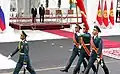 National Guard soldiers marching in front of Presidents Vladimir Putin and Sooronbay Jeenbekov at the Ala Archa State Residence.