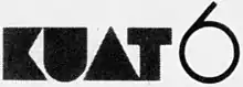 Abstract blocks forming the letters K U A T next to a thin, geometric "6"