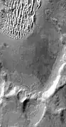 Detail of south wall of Kaiser Crater, as seen by THEMIS. Top of image shows part of a dune field.