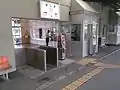 A view of the ticket gate with a SUGOCA card reader.