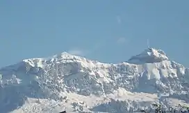 Picture showing snow covered mountains against a clear blue sky