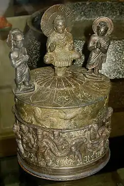 The "Kanishka casket," with the Buddha surrounded by Brahma and Indra, and Kanishka on the lower part, AD 127.