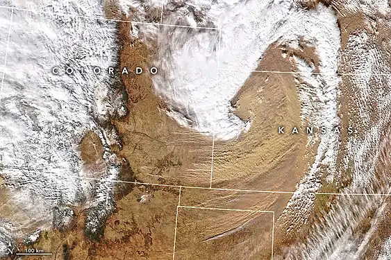 Due to gusty winds caused by a low-pressure system, winds had swept dust into southeastern Colorado and western Kansas.