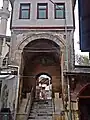 The entrance gate of the mosque courtyard by the historic covered bazaar