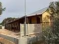 The ex-Irymple station building at its present location as the “Karadoc” terminus of the Red Cliffs Historical Steam Railway in June 2023.