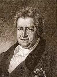 Black and white print of a man with a double-chin wearing a dark coat with a decoration on the breast.