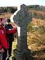 The gravestone of Margaret Keir, widow of William Small being examined for lichens