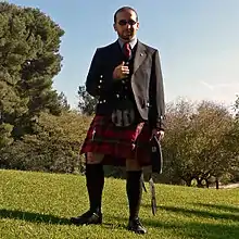 Black Barathea Silver Button Argyll (BBSBA) jacket, worn with a five button waistcoat and long tie for day wear (2006)