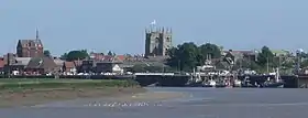 King's Lynn, known for both King's Lynn Minster and a statue to George Vancouver. The town is the administrative centre and largest settlement in the borough.