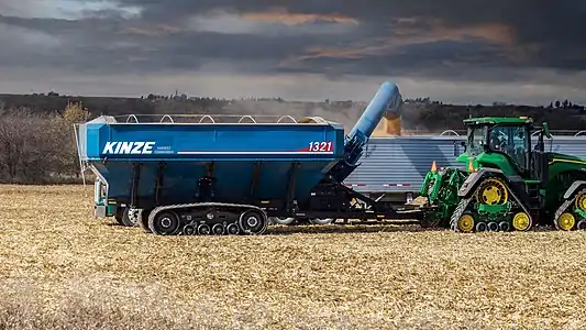 Kinze Grain Cart loading grain in field