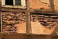 The wattle and daub was covered with a decorated layer of plaster.