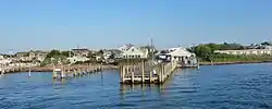 The town of Kismet on Fire Island is seen from the Fire Island Ferry on bay side of the island in the early evening during the summer.