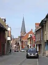 Dorpsstraat in Koekelare with Saint Martinus Church