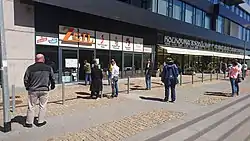 COVID19 – people waiting in front of restaurant in Prague for takeaway.