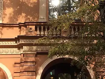 Frieze, rosette and balustrade