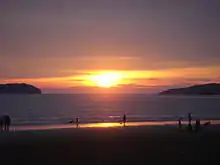 Sunset at Tanjung Aru beach. Pulau Sulug can be seen on the left and Pulau Manukan on the right of the horizon.