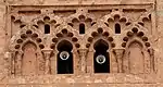 Blind interlacing multifoil arches on the Almohad minaret of the Kutubiyya Mosque in Marrakesh, Morocco (12th century)