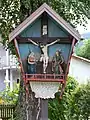 Wooden wayside cross in Völs, Tyrol, Austria.